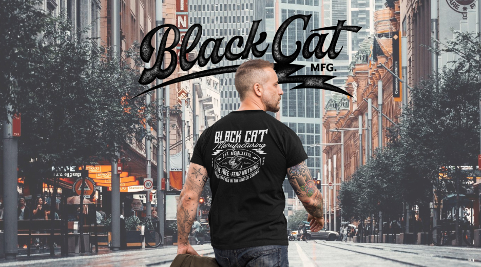 alt="Black Cat MFG USA-made cotton tee with back print in city background"
